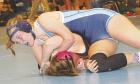 SCHS freshman Riley Suppes pins Alysa Jara (Lamar, Colo.) during the first period in the 155-pound division at the Scott City Classic. (Record Photo)
