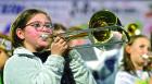 Scott City Middle School band members recently took to the field for a halftime performance during the SCHSTMP football game. (Top) Flute players are Brailey Cook and Sophia Goode. (Left) Playing the trombone is Brynlee Dare. (Record Photos) Scott City Middle School