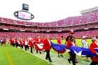 The U.S. flag is carried onto the field at Arrowhead Stadium. reigniting border wars