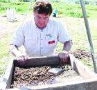 Sifting dirt in search of possible artifacts is KATP volunteer Britt Colle of Little River. (Record Photo) Evidence should be enough to include site on National Register