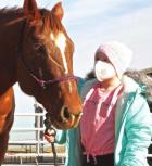 Brooklyn Wiechman gets acquainted with her quarterhorse that recently arrived at her farm home through the help of area individuals and the Make-a-Wish Foundation. (Record Photo) A wish comes true