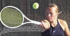 Scott City junior hits a return during singles action. (Record Photo) Lady Beavers qualify 3 for state tournament