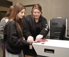 SCHS junior Juilianne Metlen gets fingerprinted by jailer Kailee Howard at the Law Enforcement Center. (Record Photo) growing our own