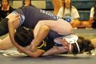 SCHS 135-pounder Ashlyn Pazdernik pins Goodland’s Lesly Dominguez during the GWAC tournament last Friday. Pazdernik claimed a league championship. (Left) SCHS junior Collin McDaniel is with Ross Addison who officiated McDaniel’s 100th career varsity w a GWAC sweep
