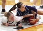Scott City junior Piper Fox wins the battle for a loose ball during Friday’s game against Holcomb. (Record Photo)