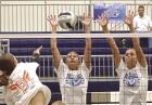 Kayden Holstein (left) and Katie Weathers combine for a block during action against Dighton on Monday in the Beaver Bash. (Record Photo)
