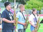 (Right) Band director Elizabeth Janssen gives instruction to one of the instrument sections. (Below) Members of the saxophone section performing a song are Aaden Arreola, Carson Gabel and Phebe Trout. (Record Photos)