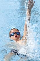 Colborn Trout of the Scott City Stars competes in the backstroke. (Record Photo) Stars claim 22 golds at Hays; Rodriguez is winner in 4 events
