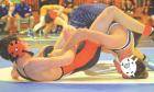 Scott City freshman Collin McDaniel tilts Hoxie’s Carson Ochs to his back for a two-point near fall in the third period of their 120-pound championship match at the Norton tournament on Saturday. (Record Photo) McDaniel, Bowers add to gold medal collection at Norton