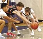 SCHS senior Brody Stoecklein (right) gets a steal while teammate Junior Meza is ready to assist during the opening round of the Roundball Classic against Tonganoxie last Thursday. (Record Photo)