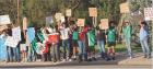 Peaceful protesters line the block at Patton Park along US83 Highway in Scott City showing their support for immigrants last Thursday evening. ( Record Photo)