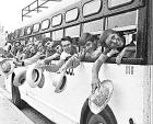 Students from Hilltop High School in Chula Vista, Calif., wave goodbye from the windows of a bus as they leave for Blythe, Calif., to work in the agricultural fields. Students from Hilltop High School in Chula Vista, Calif., wave goodbye from the windows of a bus as they leave for Blythe, Calif., to work in the agricultural fields.
