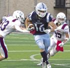 Senior halfback Avry Noll splits a pair of Russell defenders for a big gain during last Friday’s Jamboree action at Great Bend. (Record Photo) Ball security, defensive discipline are main takeaways from Jamboree