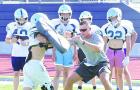 Assistant coach Drew Kite goes over the technique needed for his linebacker group to shed blockers during last week’s SCHS football camp. (Record Photo) Assistant coach Drew Kite goes over the technique needed for his linebacker group to shed blockers during last week’s SCHS football camp. (Record Photo)