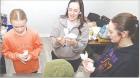 Lillian Vondracek (left) of Scott City and Aubrey Coash, Garden City, practice making “boo-boo bunnies” with assistance from Scott County Health Department director Edith Tarango. (Record Photo) Lillian Vondracek (left) of Scott City and Aubrey Coash, Garden City, practice making “boo-boo bunnies” with assistance from Scott County Health Department director Edith Tarango. (Record Photo)