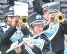 SCHS musicians performing at Hays on Monday were (from left) Oscar Mendez, Maile Deppershmidt and Logan Stoppel. (Below) Max Contreras was half of the flag team that earned a “superior” rating. (Record Photo) SC band marches to it own beat at Hays festival