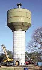 The new Scott City water tower took another major step towards completion last week when the steel tank was elevated to the top of the concrete base using hydraulic lifts. The 500,000 gallon tank was raised at the rate of seven inches per minute. Painting The new Scott City water tower took another major step towards completion last week when the steel tank was elevated to the top of the concrete base using hydraulic lifts. The 500,000 gallon tank was raised at the rate of seven inches per minute. Painting