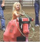 Four-year-old Kashley McDaniel shows her skills during the dummy roping for youngsters which was held between barrel racing and jackpot team roping at the Scott County Fairgrounds on Tuesday evening. (Record Photo)