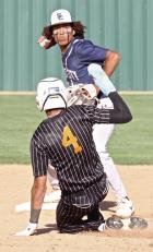 Scott City shortstop Eloy Ruelas turns a double-play during Class 3A regional tournament action against Colby last Friday. (Record Photo)