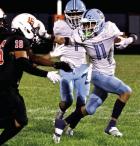 Scott City junior Adan Tarango stiffarms a Ulysses defender during a kickoff return last Friday. (Record Photo)