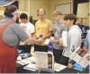 SCHS seniors visiting with a representative from Wichita State University Vo-Tech during College Day are (from left) Ian Rodriguez, Mickey Gossman, Carson Bennett and Martin Purma. (Record Photo)