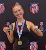 Maddie Goode with her awards, including a national championship ring, after winning the AAU pole vault competition in the 15-16-year division.