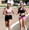SCHS cross-country members Phebe Trout (left) and Hanna Winter on a timed run during Monday’s practice. (Record Photo)