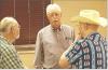 State Rep. Jim Minnix (R-Scott City) visits with two constituents during a candidate forum in Scott City last Thursday. (Record Photo)