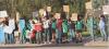 Peaceful protesters line the block at Patton Park along US83 Highway in Scott City showing their support for immigrants last Thursday evening. ( Record Photo)