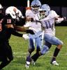 Scott City junior Adan Tarango stiffarms a Ulysses defender during a kickoff return last Friday. (Record Photo)
